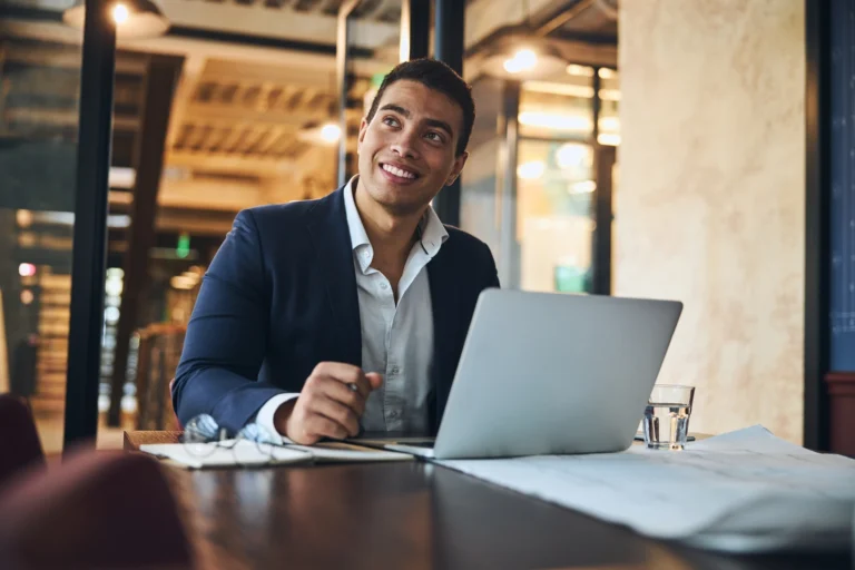 Business man working on laptop for hometown insurance